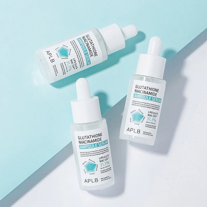 APLB Glutathione Niacinamide Ampoule Serum bottles on blue background