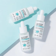 APLB Glutathione Niacinamide Ampoule Serum bottles on blue background