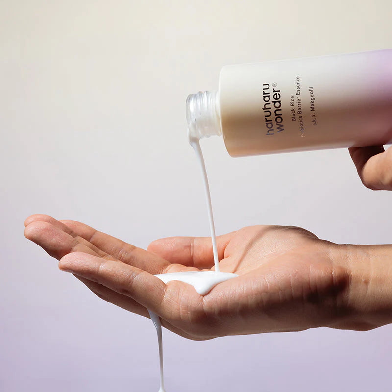 Haruharu Wonder Black Rice Probiotics Barrier Essence applied to hand