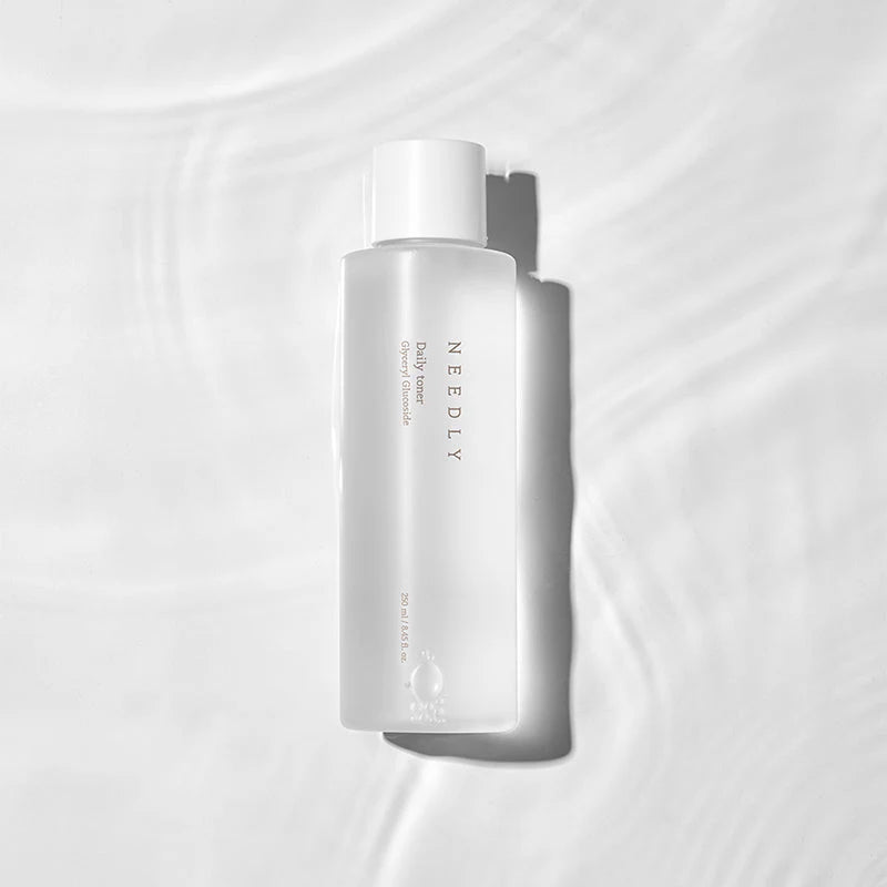 Needly Daily Toner pouring onto surface